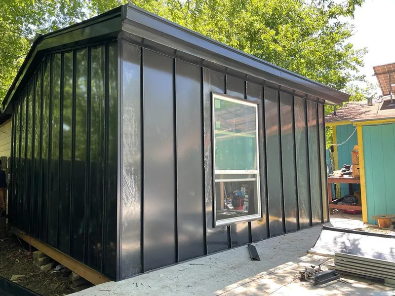 Black standing seam metal wall panels for Metal Roof Installation in Escanaba