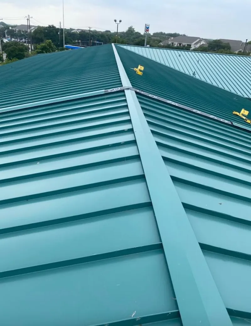 Green commercial metal roof ridge and valley for Metal Roof Repair in Escanaba